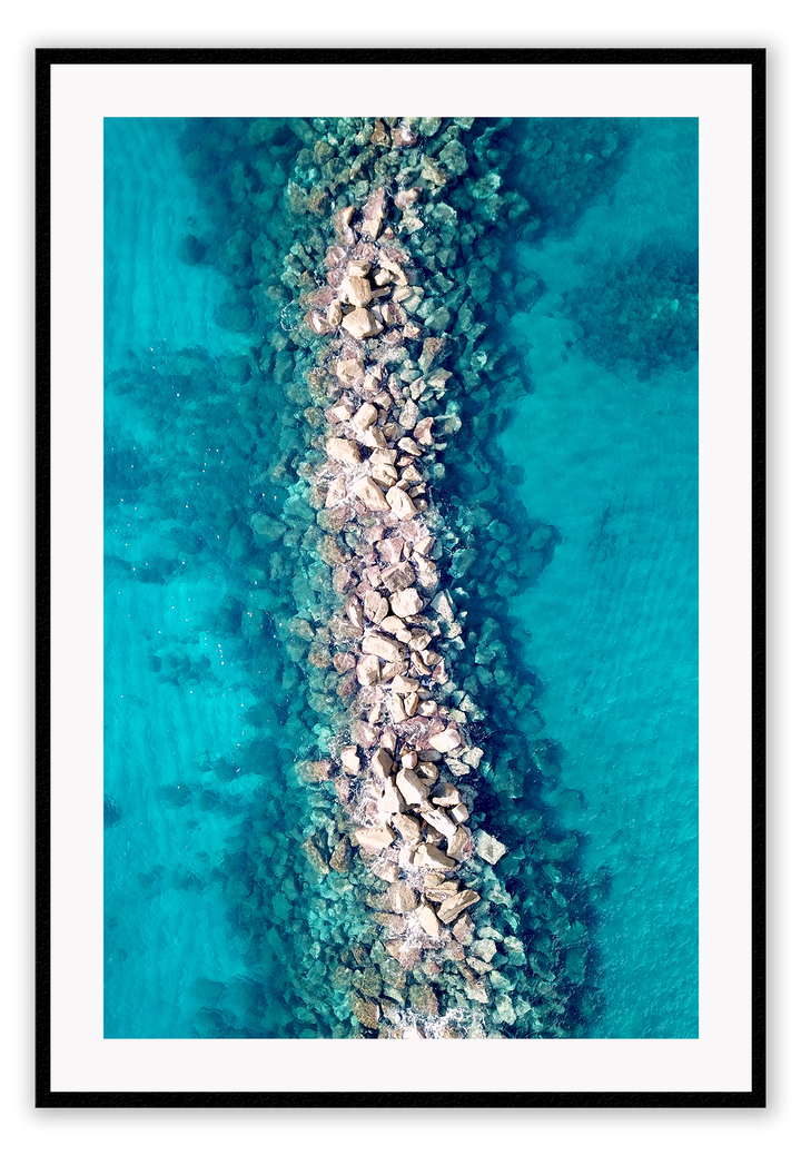 Ocean water rocks blue symmetry waves ripple clear sea