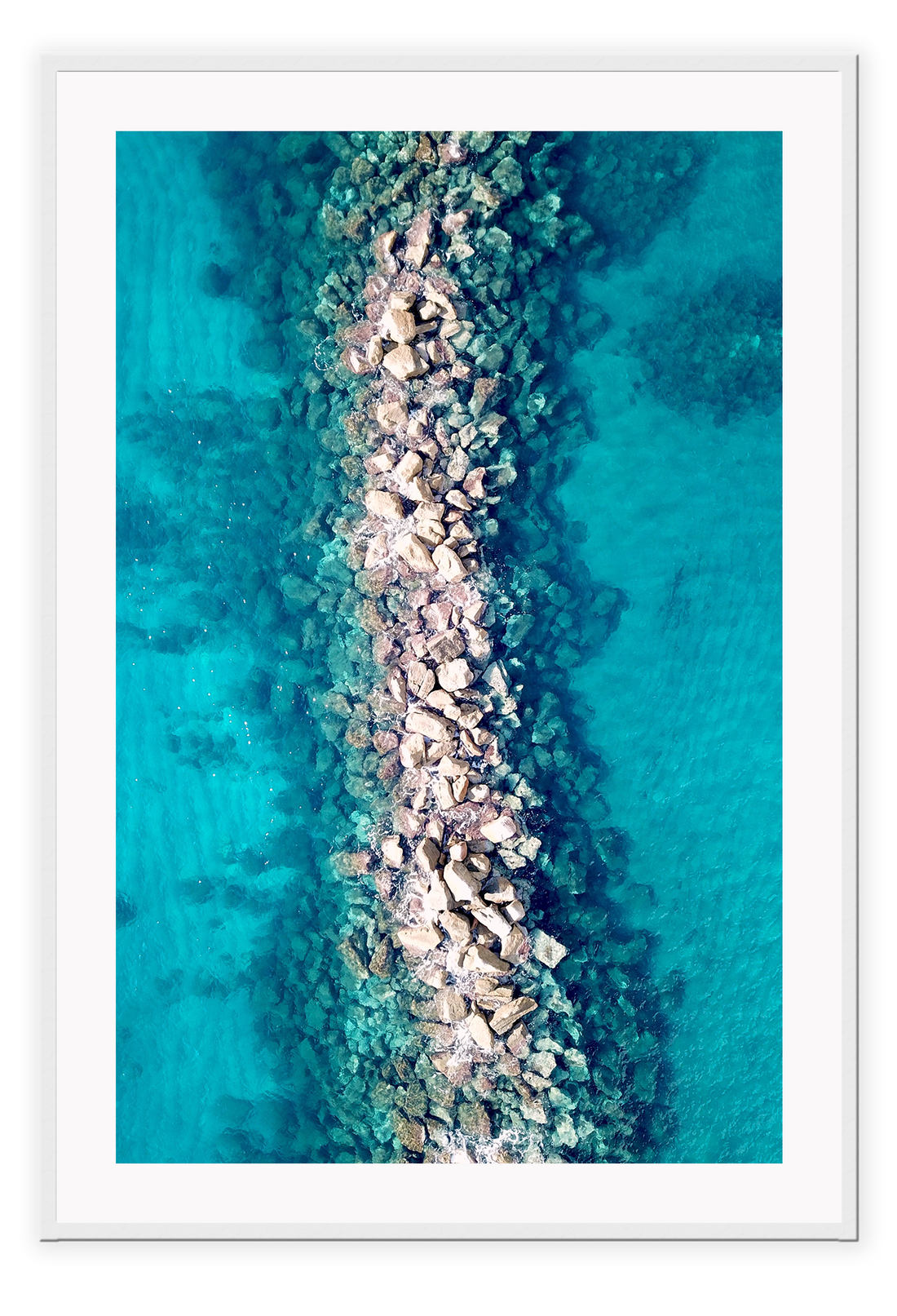 Ocean water rocks blue symmetry waves ripple clear sea